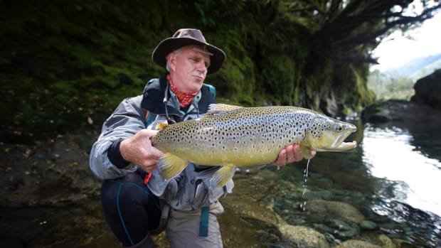 1.New Zealand guide Scott Murray holds Nick Price’s 8½-pound brown trout, which tore up waterfall-like rapids with ease.