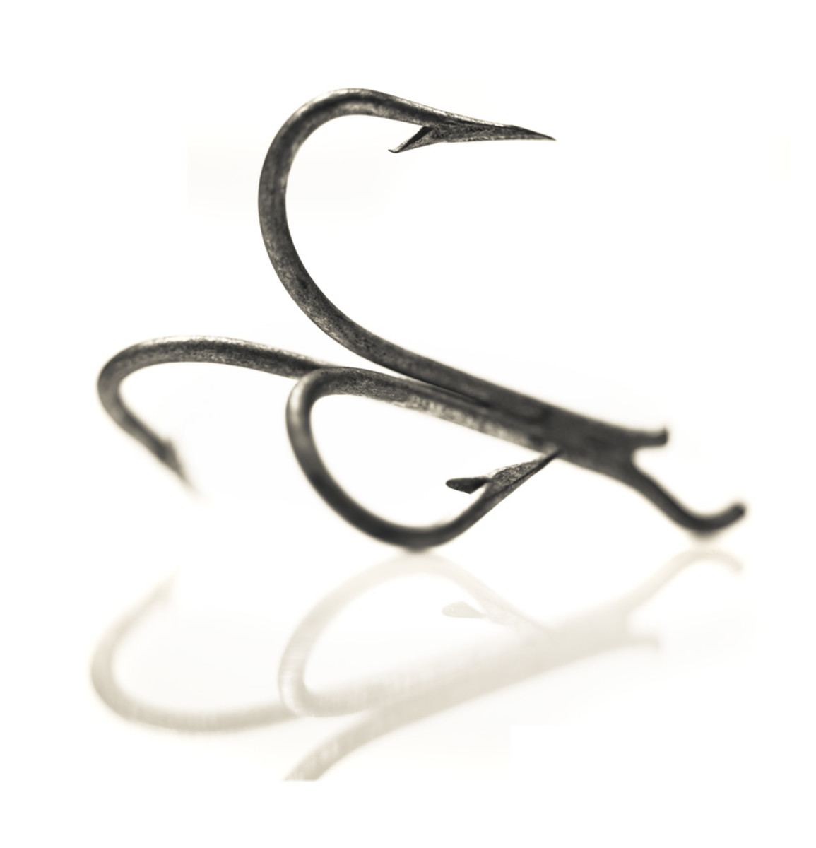 How did they do that? Try twisting a 4/0 Mustad treble hook into this shape with a pair of pliers.