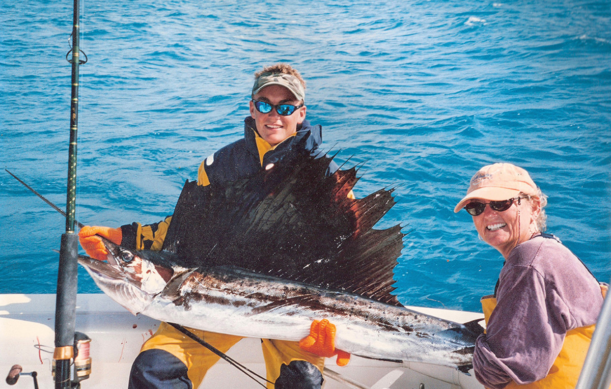 Ben Brownlee, the author’s son, with a sailfish caught by his mother, Poppy, off Alligator Reef.
