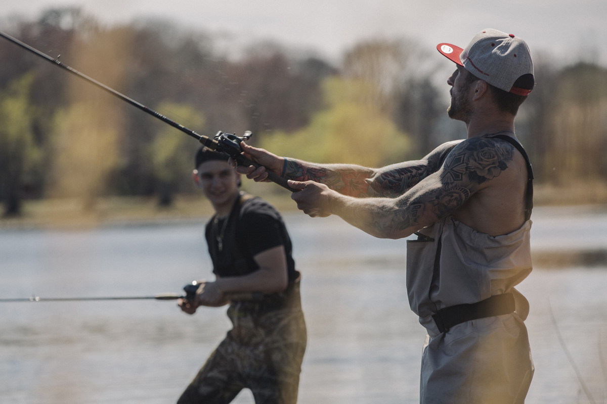 Fishing friends. Young wrestler Nick Karamoshos and mentor Gregor Gillespie unwind on a pond.