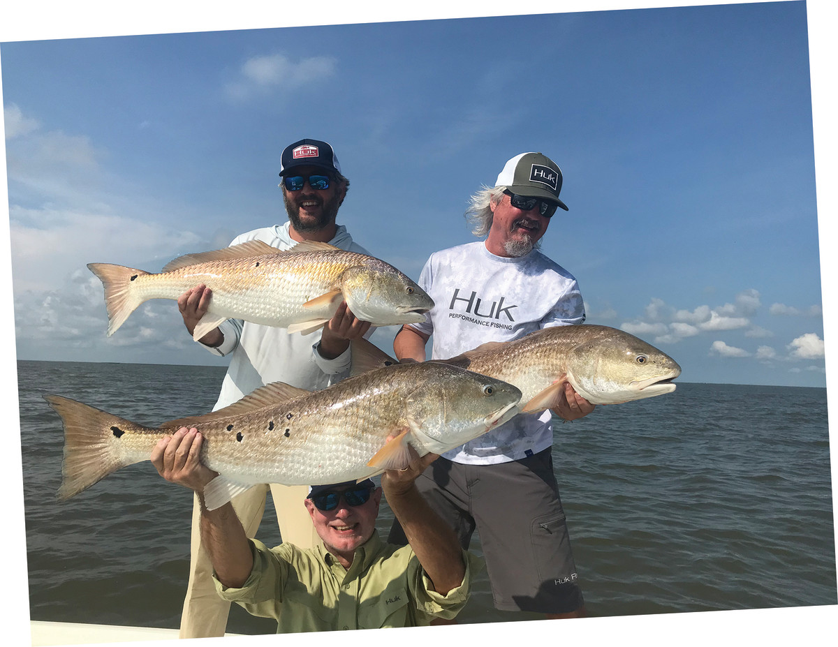 A happy trio landed sizable redfish over the course of a few days. 