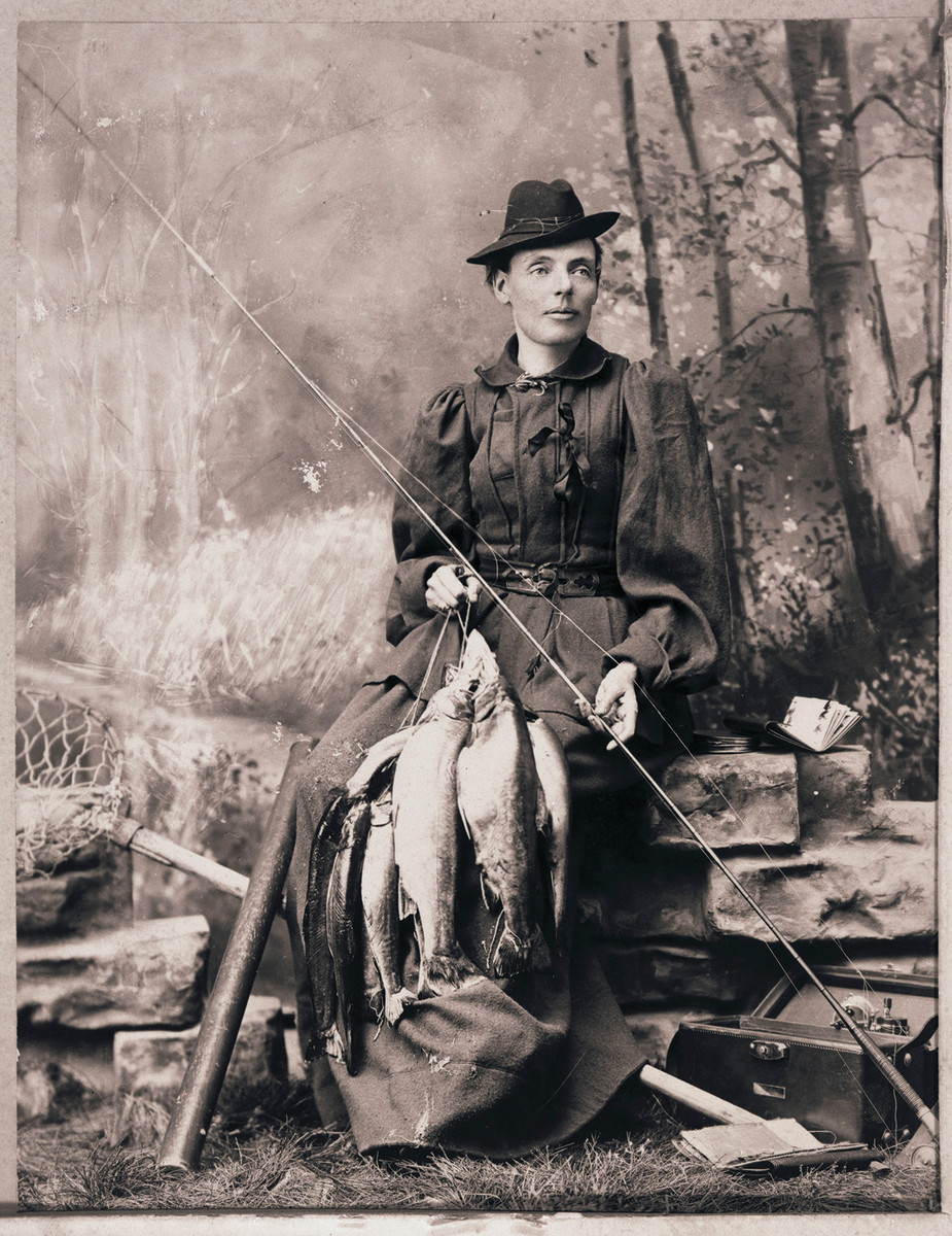 Cornelia “Fly Rod” Crosby was Maine’s first registered guide and someone who could catch. (Right) A hand-tinted photo from the 1930s.