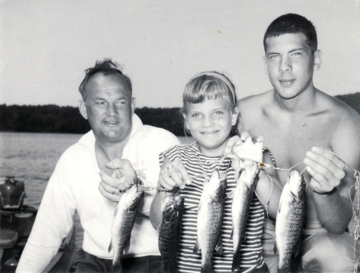A proud father and a nice stringer of bass, along with the writer and his sister. 