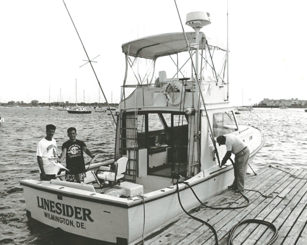 Steve Headley (left), the writer and Stephen Rhodes II (right) prep for a giant bluefin tuna trip with fresh bluefish and a refuel of their 35-foot Bruno & Stillman.
