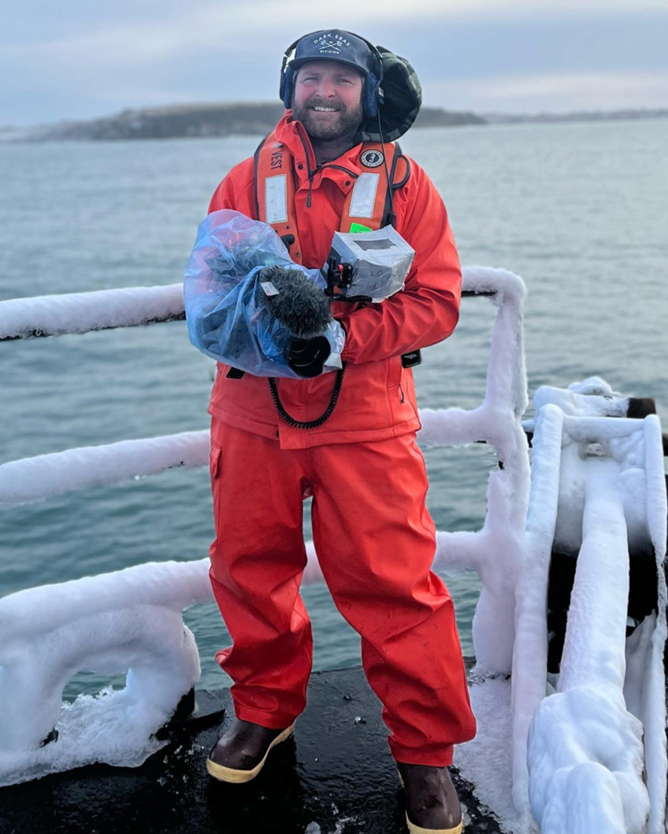 Southern California filmmaker and angler Clark McNulty all geared up to stay warm and dry on the deck of a crab boat while filming for Deadliest Catch.